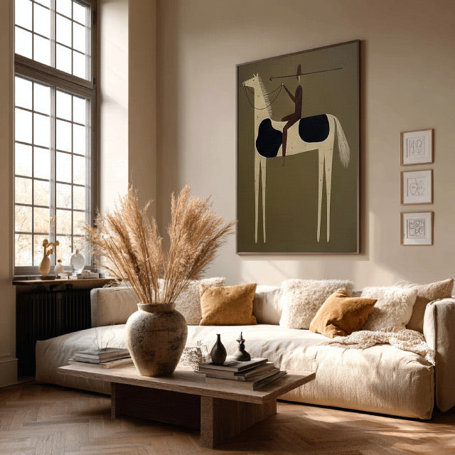 Olive green equestrian wall art above a neutral living room sofa