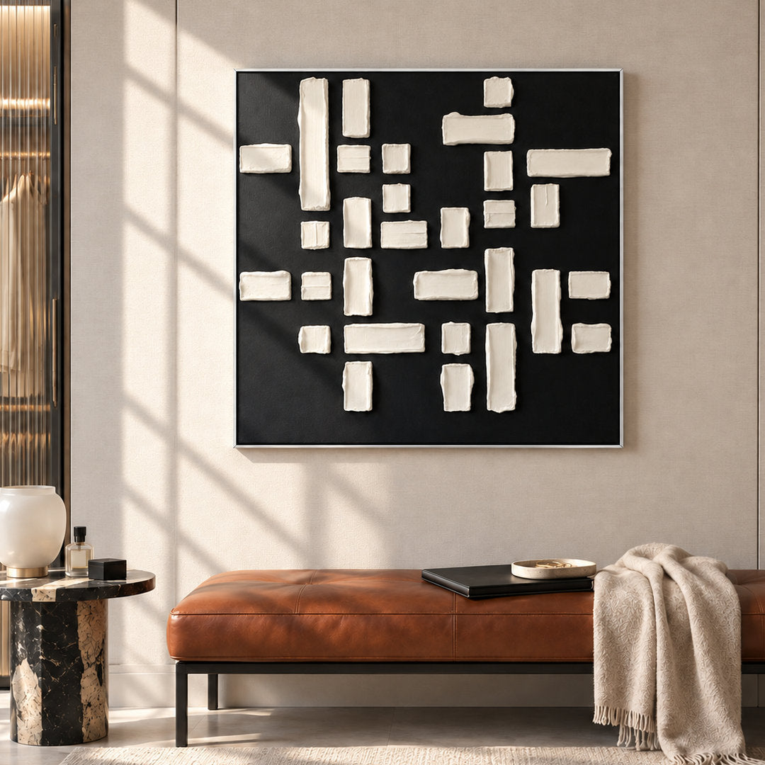 black and white geometric textured wall art with raised blocks in a coordinated modern interior