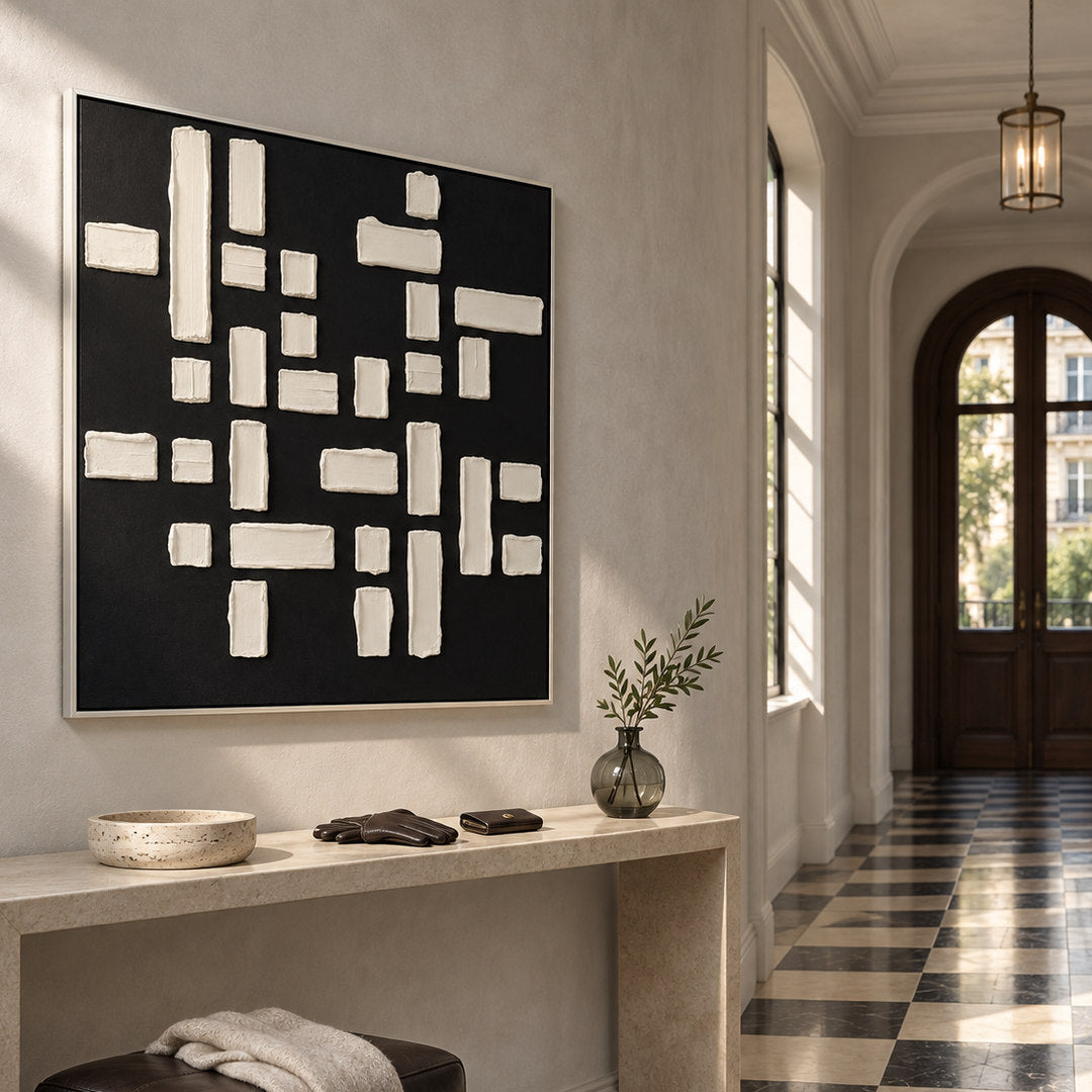 black and white geometric textured wall art with raised blocks in a coordinated modern interior