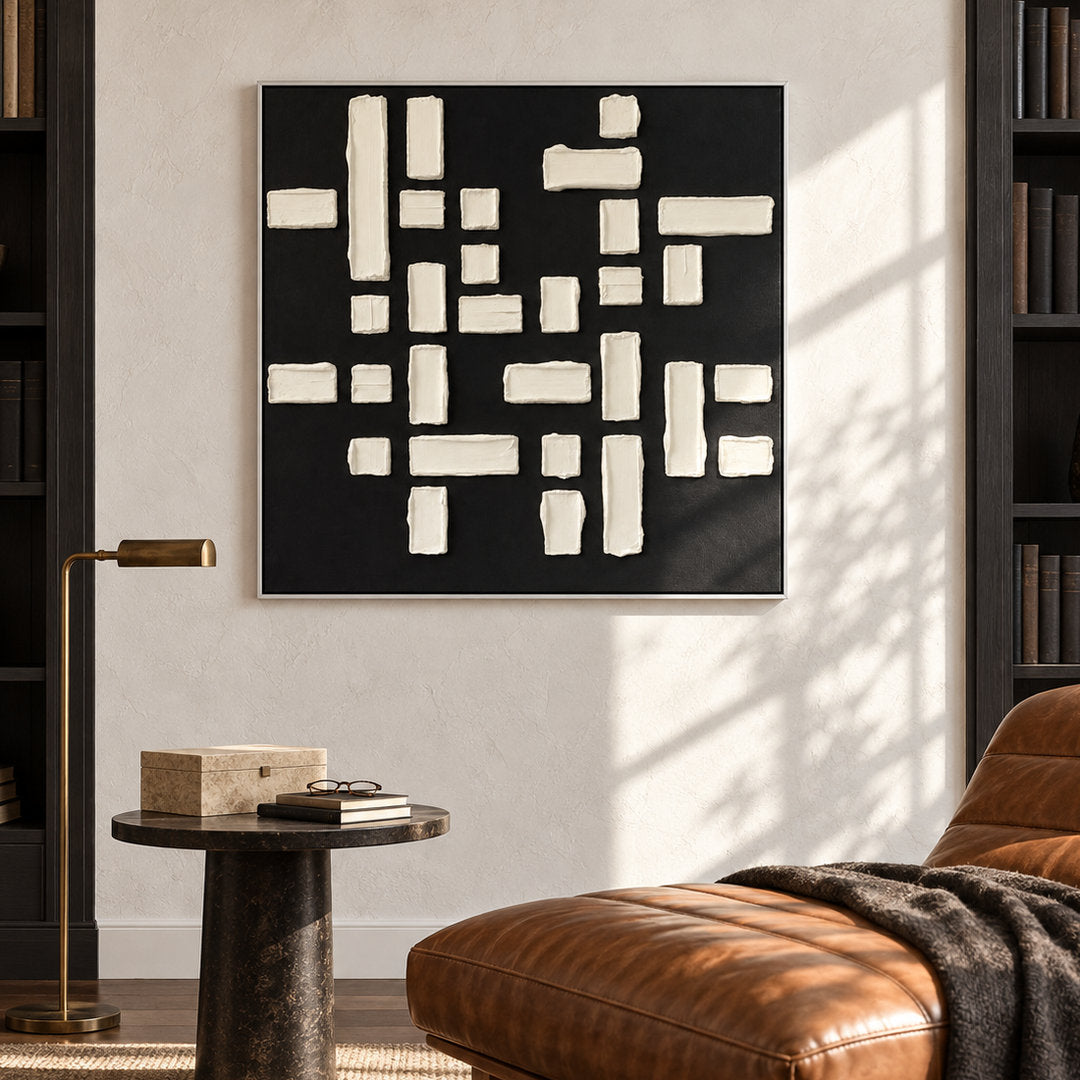 black and white geometric textured wall art with raised blocks in a coordinated modern interior