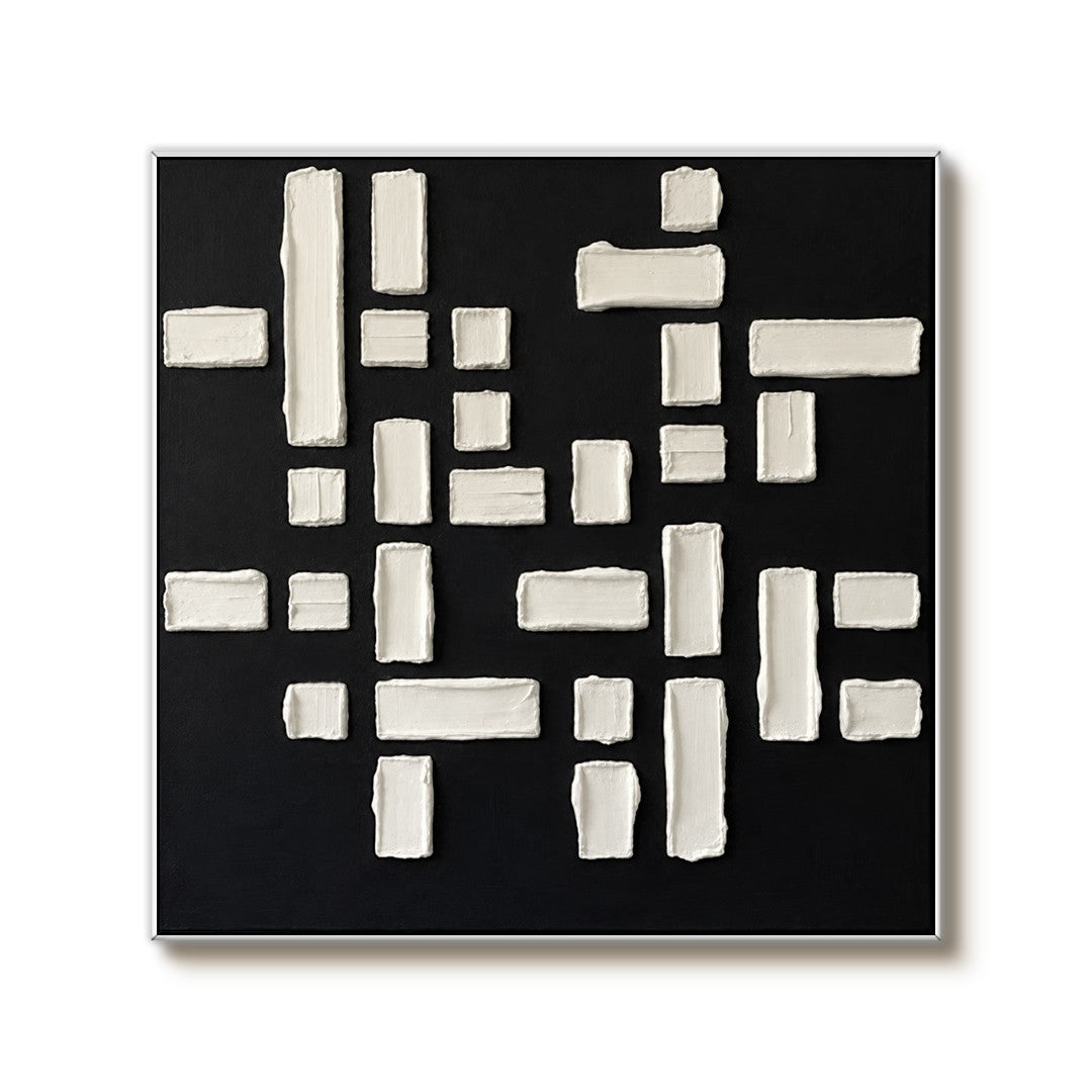 black and white geometric textured wall art with raised blocks on a clean white background