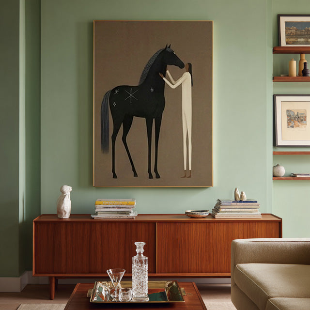 minimalist black horse and figure wall art in a coordinated modern interior