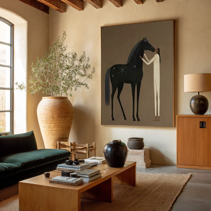 minimalist black horse and figure wall art in a coordinated modern interior