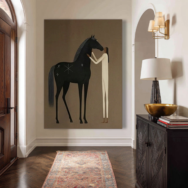 minimalist black horse and figure wall art displayed in a styled living room