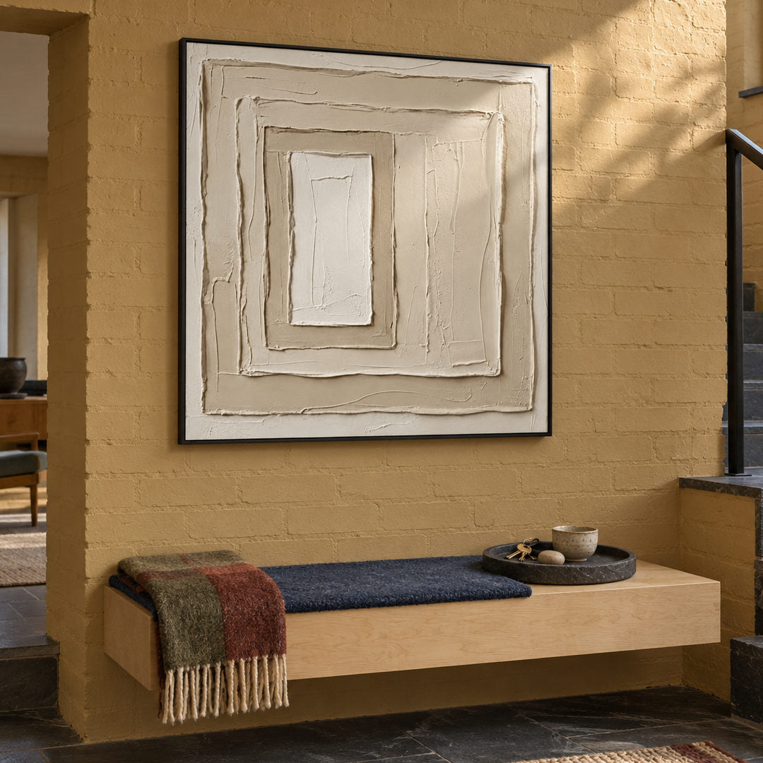 neutral sculptural textured wall art with layered cream square relief in a coordinated modern interior