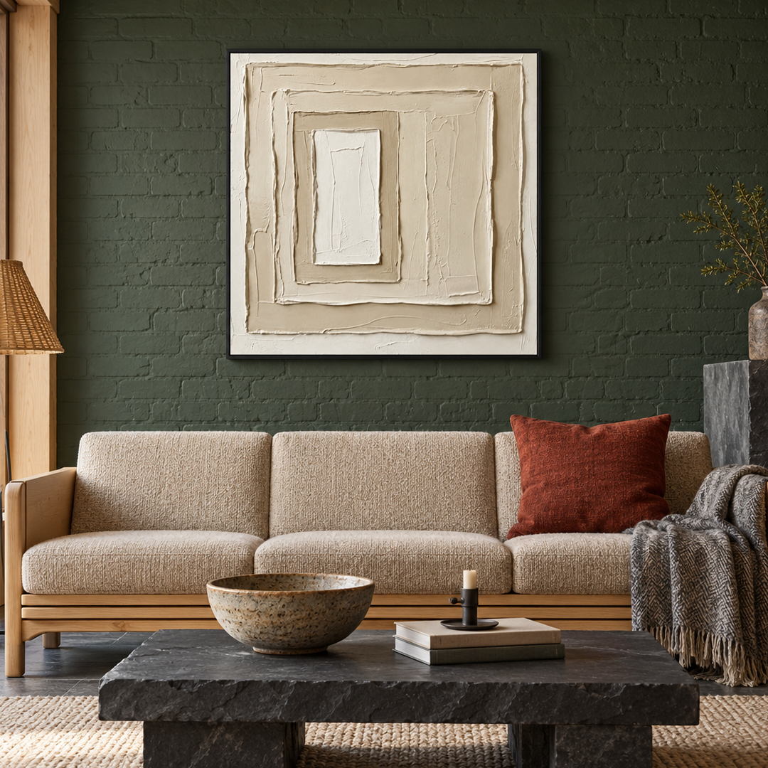 neutral sculptural textured wall art with layered cream square relief displayed in a styled living room