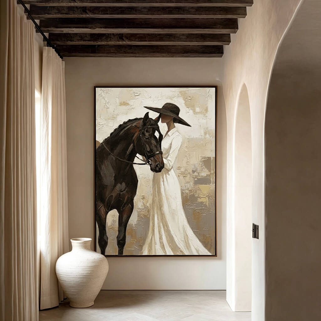 neutral cowgirl and black horse wall art in cream and white in a coordinated modern interior