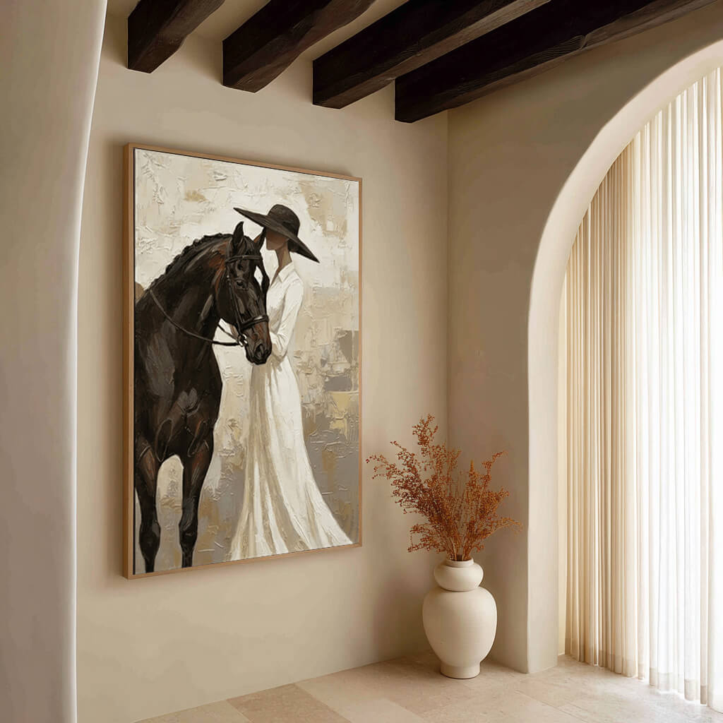 neutral cowgirl and black horse wall art in cream and white in a coordinated modern interior