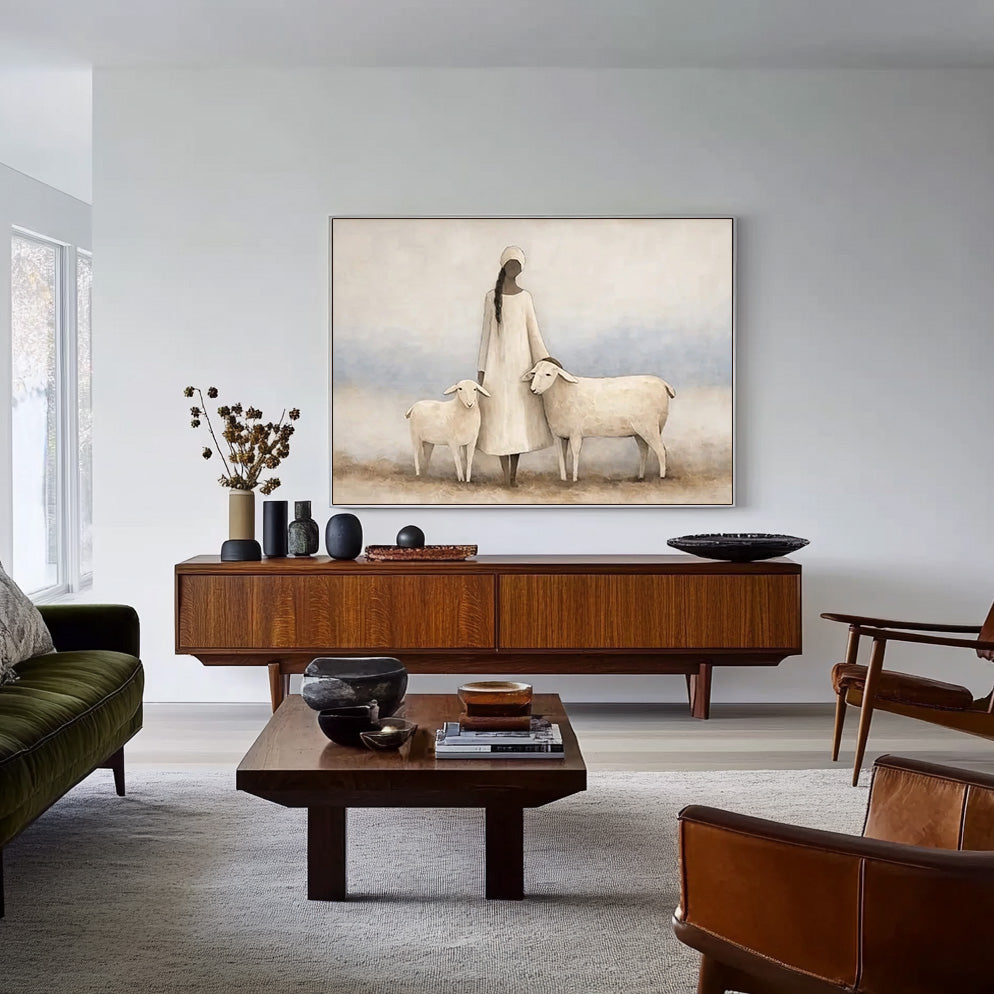 soft figurative woman and sheep wall art in a coordinated modern interior