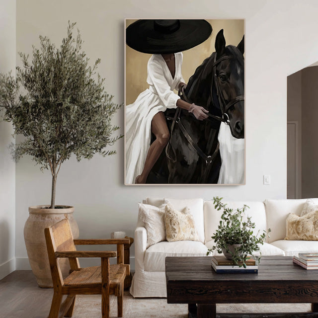 elegant black horse and cowgirl wall art in cream and white in a coordinated modern interior