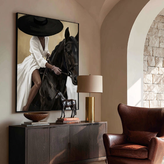 elegant black horse and cowgirl wall art in cream and white in a coordinated modern interior