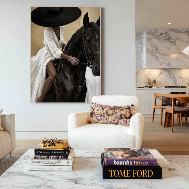 elegant black horse and cowgirl wall art in cream and white in a coordinated modern interior