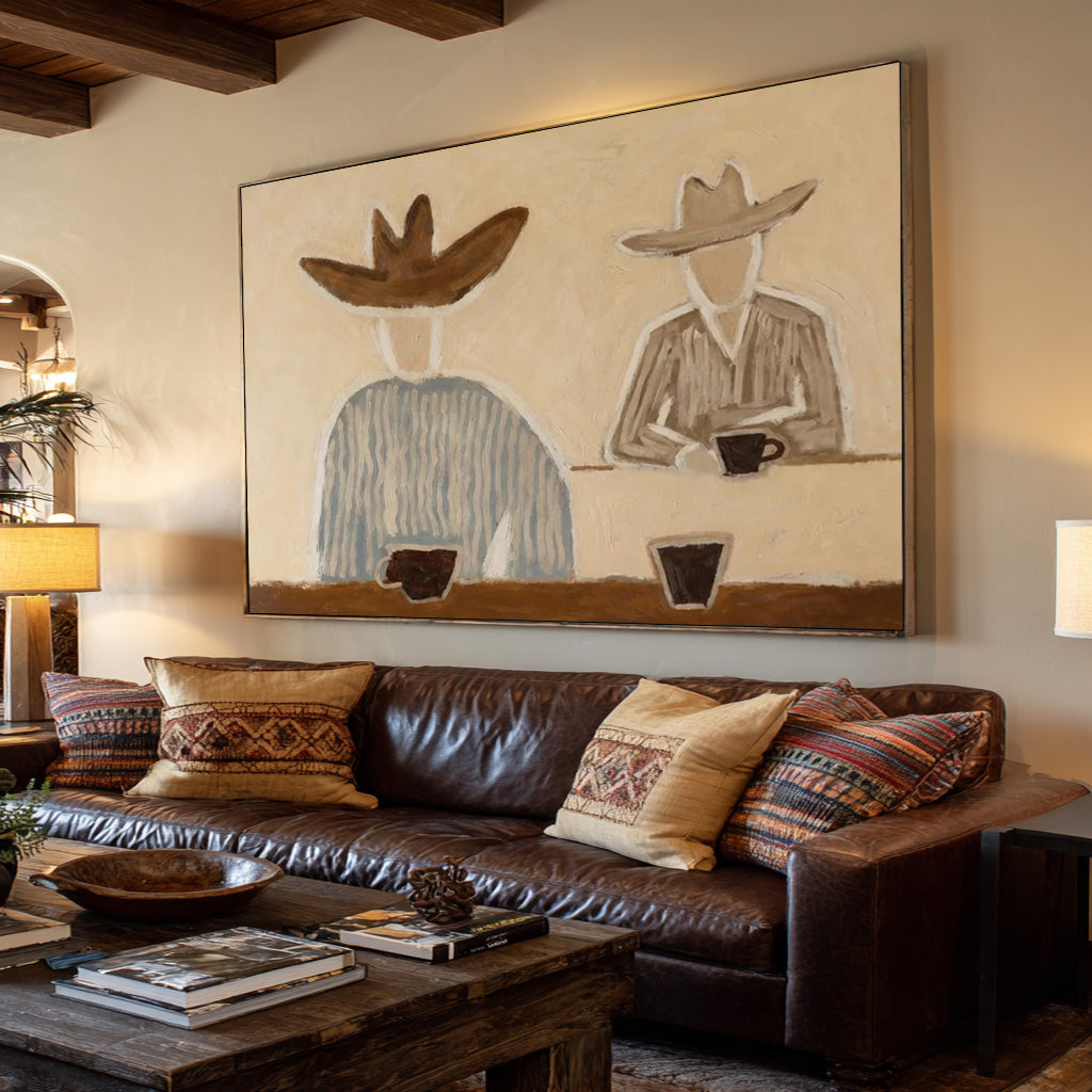 folk Western cowboy wall art displayed in a styled living room