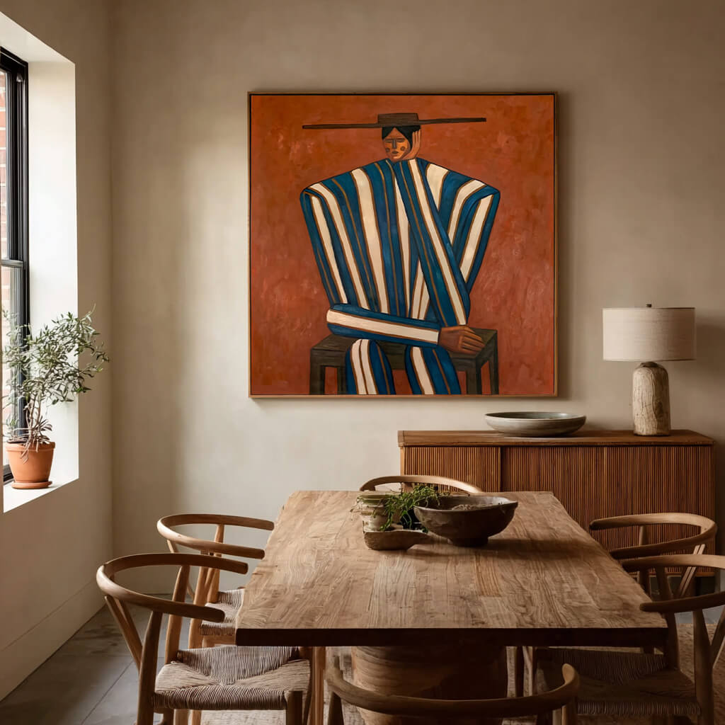 folk Western figurative wall art in blue white and burnt orange in a coordinated modern interior