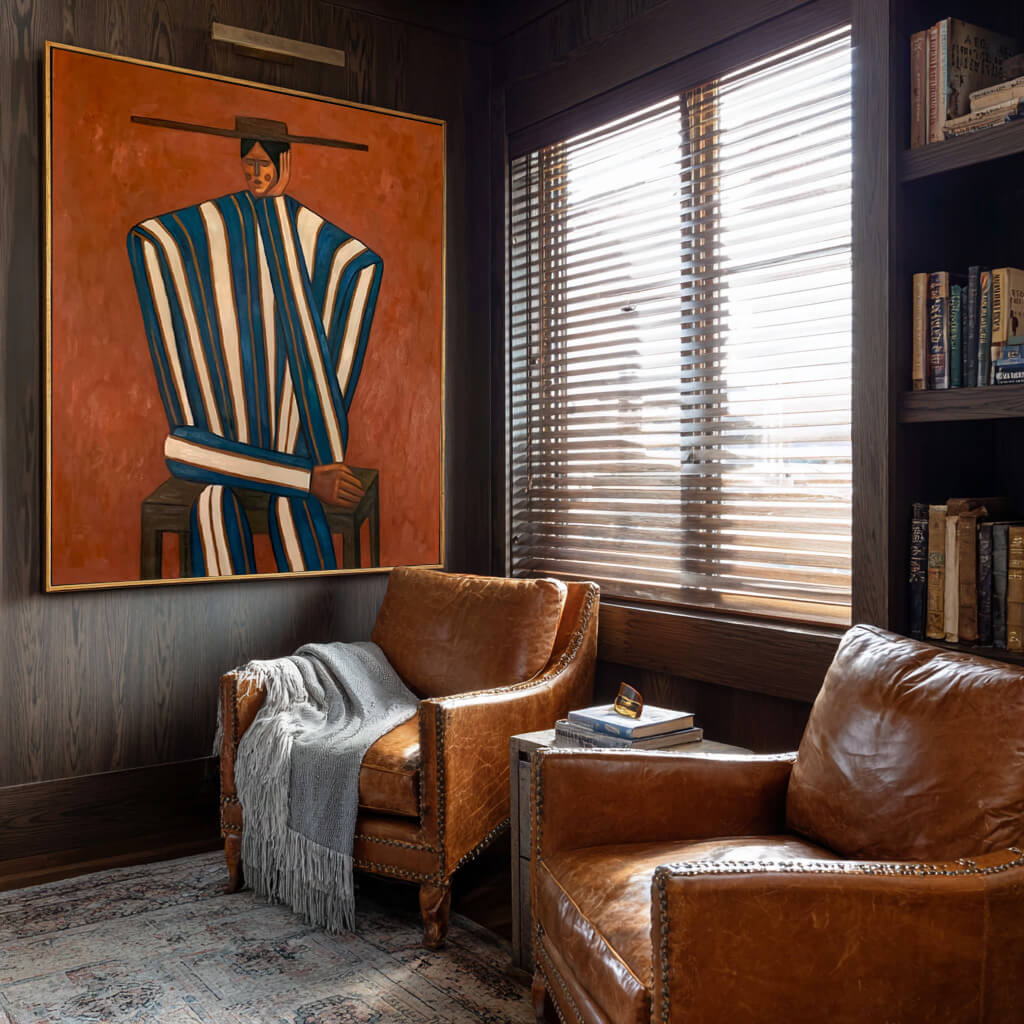 folk Western figurative wall art in blue white and burnt orange in a coordinated modern interior
