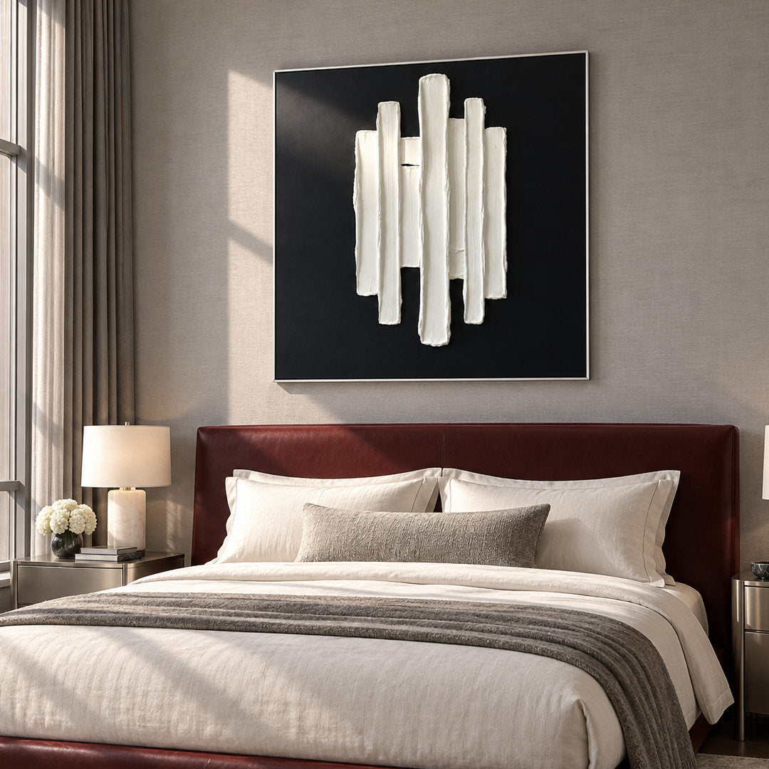 black and white sculptural wall art with vertical raised pillars in a coordinated modern interior