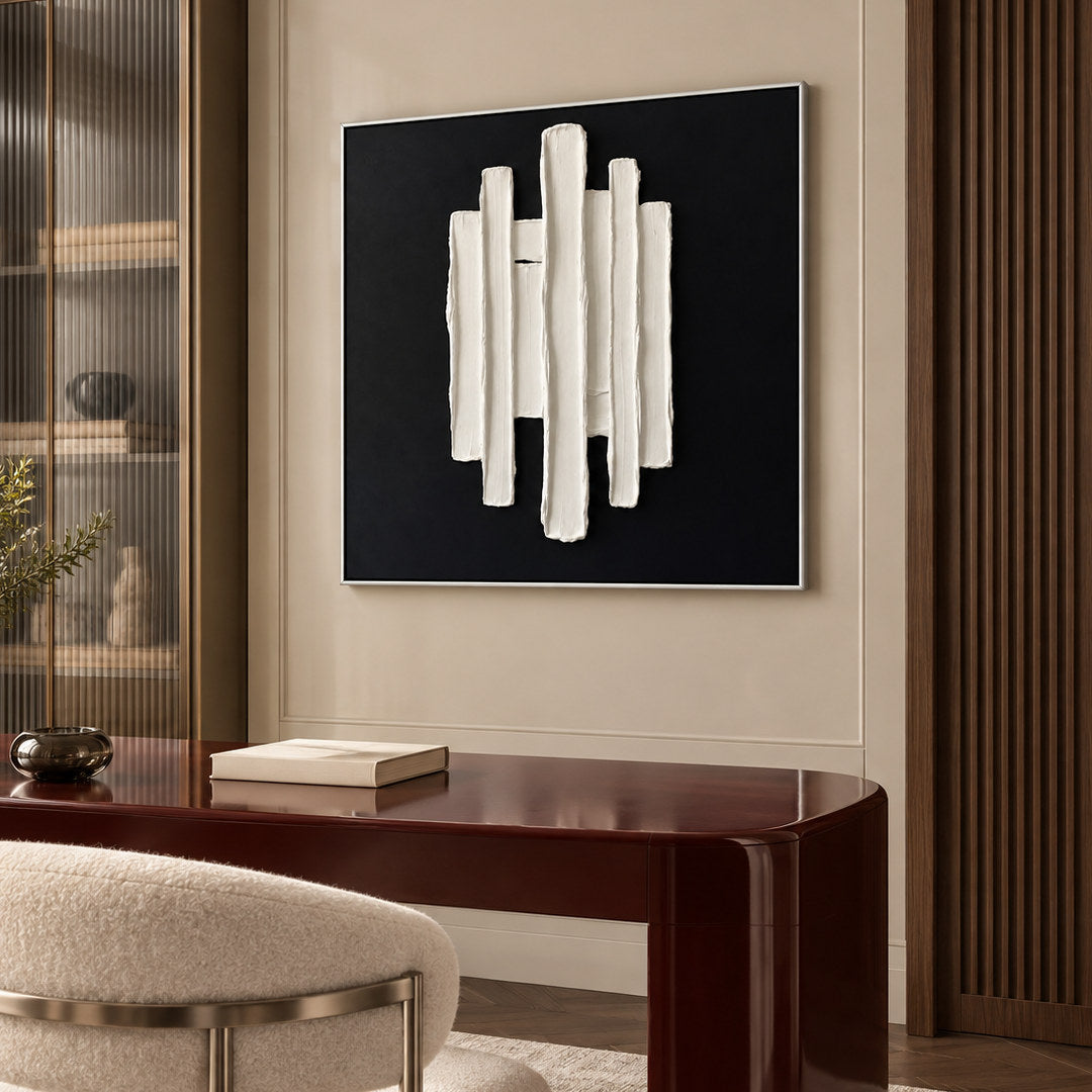 black and white sculptural wall art with vertical raised pillars in a coordinated modern interior
