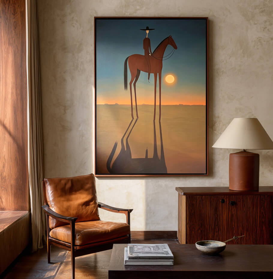 minimalist Western horse rider wall art in muted sunset colors displayed in a styled living room