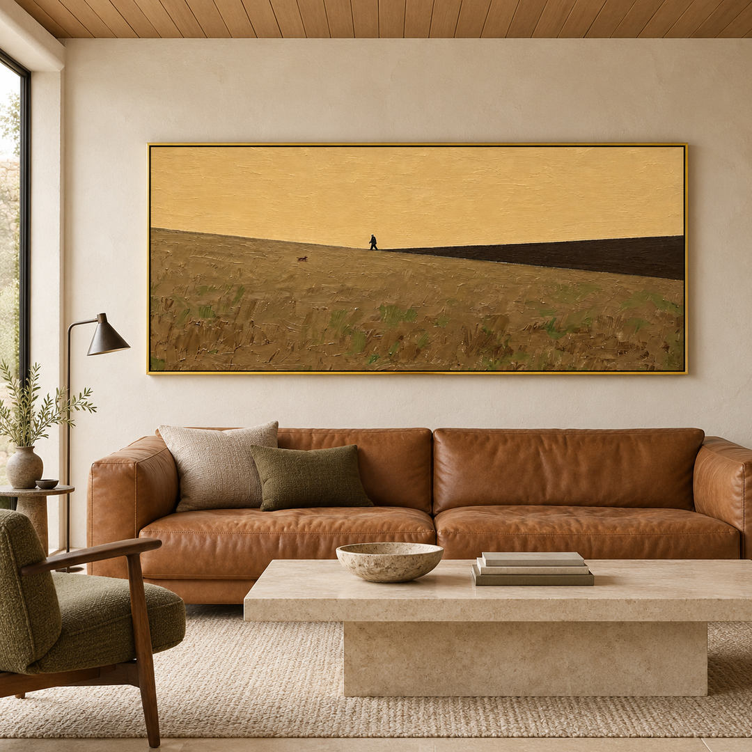 minimalist panoramic landscape wall art in ochre yellow and muted olive displayed in a styled living room