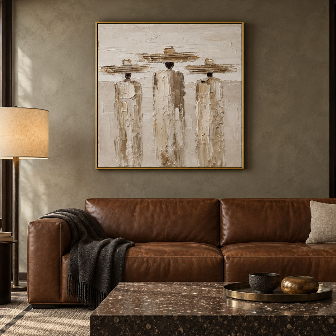 textured figurative wall art with three figures in cream beige and brown displayed in a styled living room