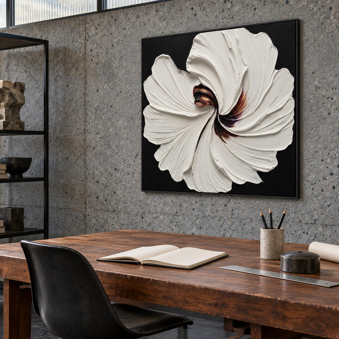 3D textured white floral wall art on black with sculptural petals in a coordinated modern interior
