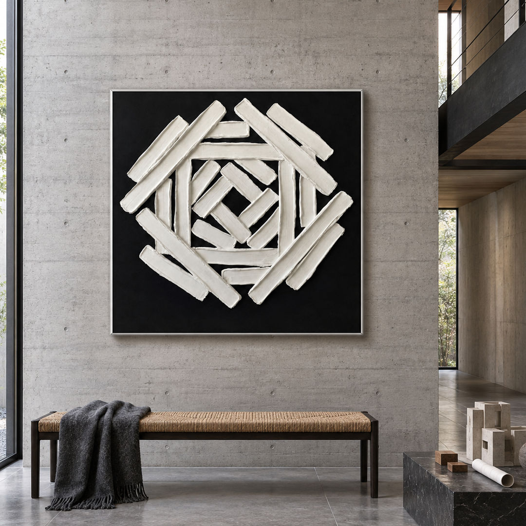 black and white sculptural wall art with interlocking geometric bars in a coordinated modern interior