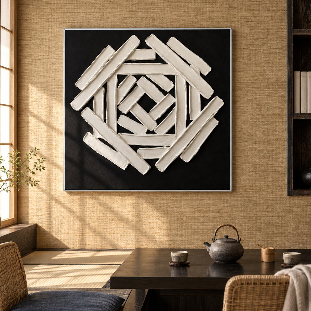 black and white sculptural wall art with interlocking geometric bars displayed in a styled living room