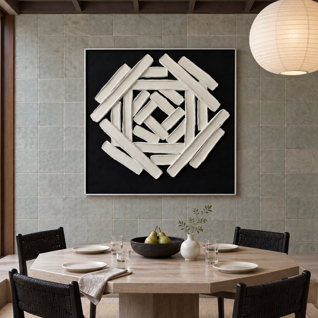 black and white sculptural wall art with interlocking geometric bars in a coordinated modern interior