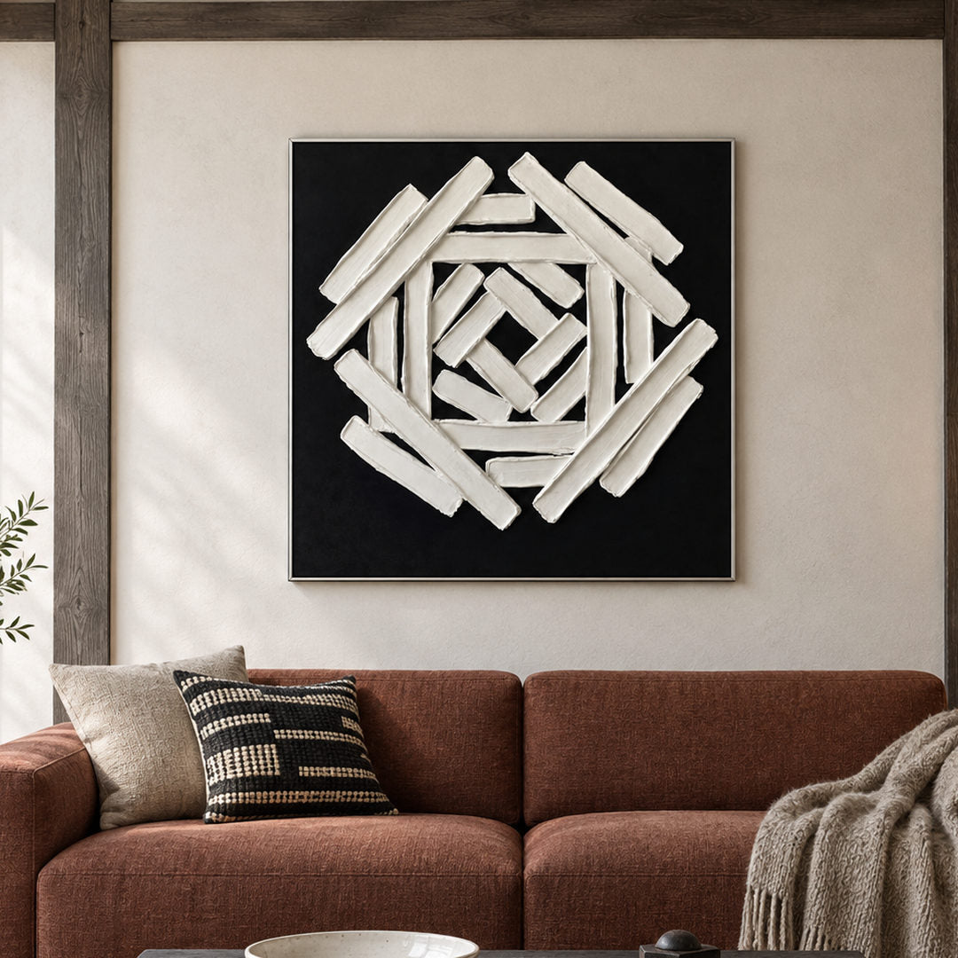 black and white sculptural wall art with interlocking geometric bars in a coordinated modern interior