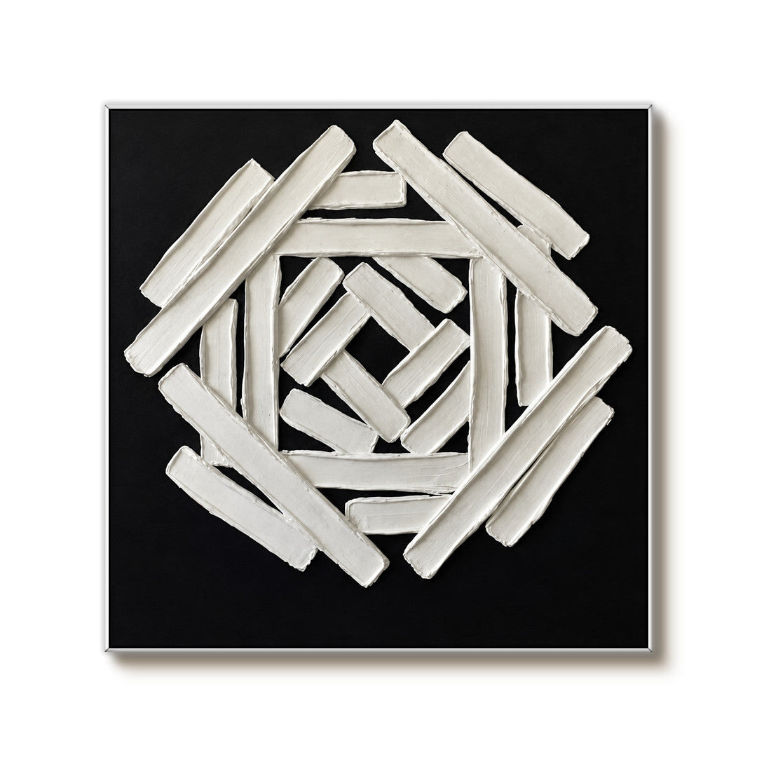 black and white sculptural wall art with interlocking geometric bars on a clean white background